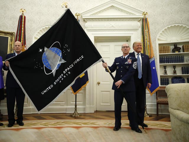 The presentation of the official Space Force flag in the Oval Office