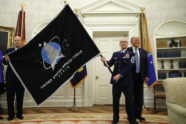 The presentation of the official Space Force flag in the Oval Office