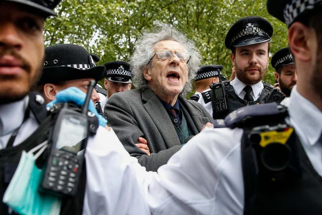 Police officers apprehend Piers Corbyn, Jeremy Corbyn's brother, during a demonstration against the coronavirus lockdown in Hyde Park on 16 May
