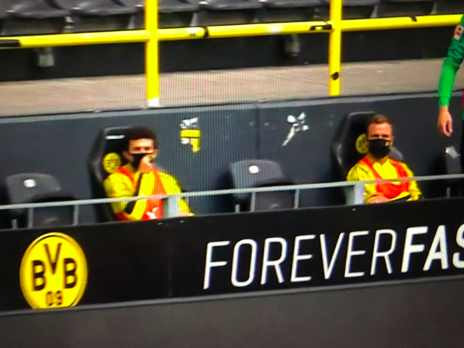 Borussia Dortmund substitutes wear face masks and sit 2m apart as Bundesliga returns