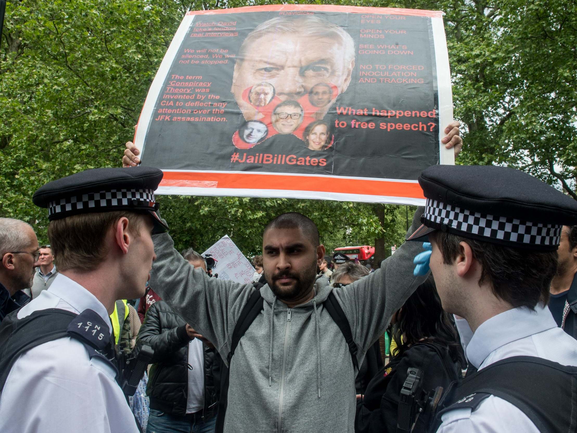 Police speak to a protestor as conspiracy theorists gather at Hyde Park Corner on 16 May 2020 in London
