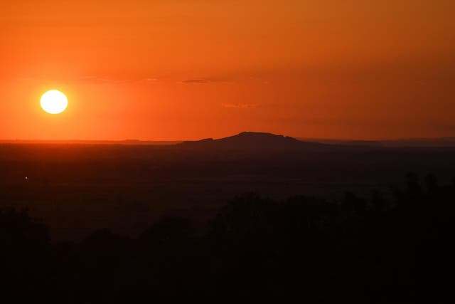 The sun sets on 14 May, 2020, in Glastonbury, England.
