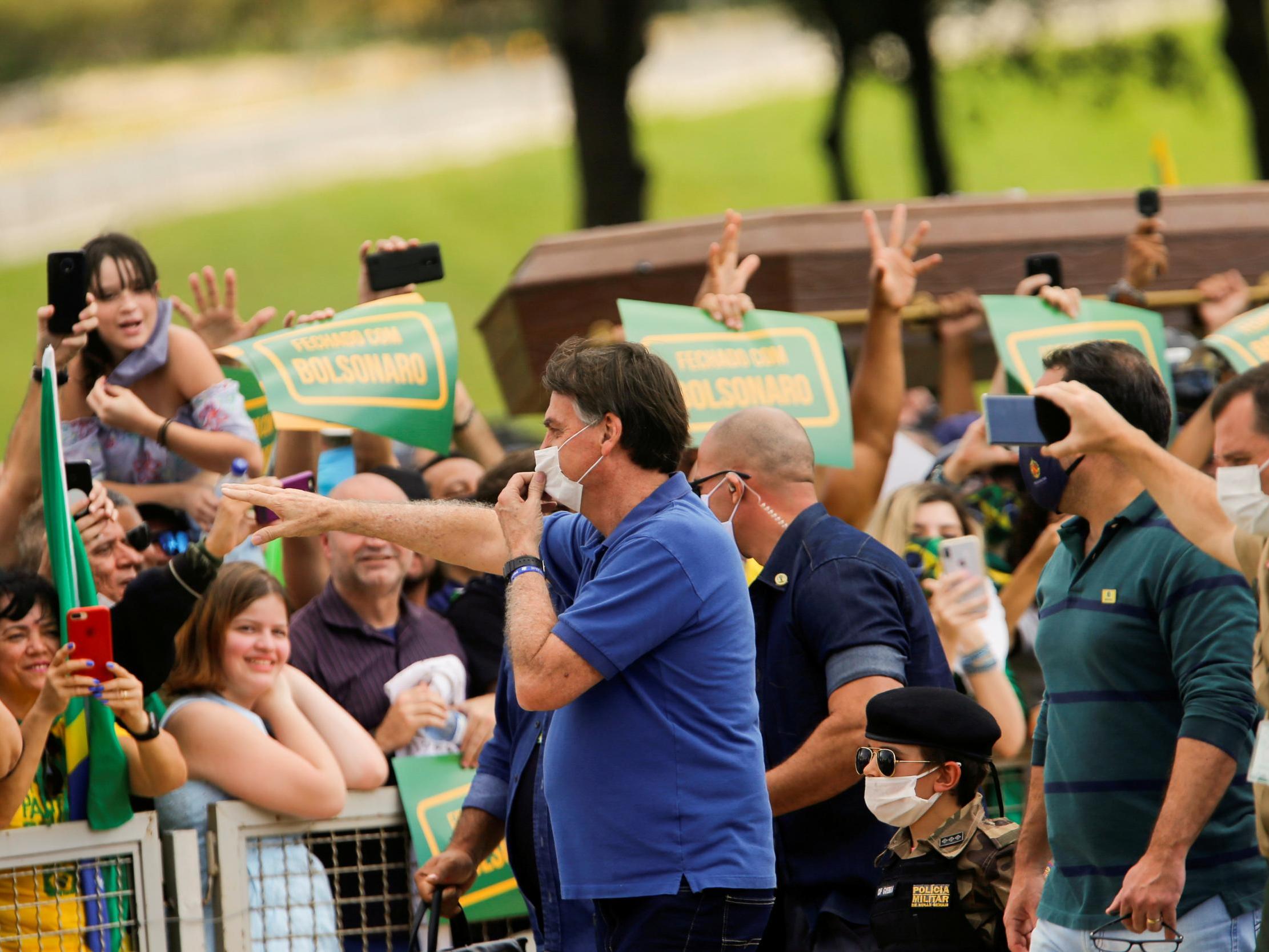 Coronavirus: Bolsonaro defies health advice to pose with supporters as Brazil becomes fourth most-infected country