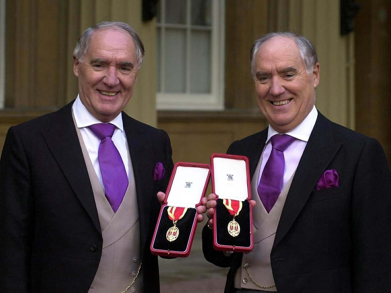 Sir David Barclay (left) and twin brother Sir Frederick after receiving knighthoods in 2000