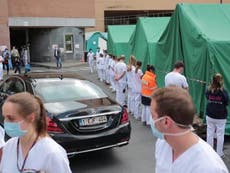 Medics turn their backs in protest at Belgian PM’s handling of virus