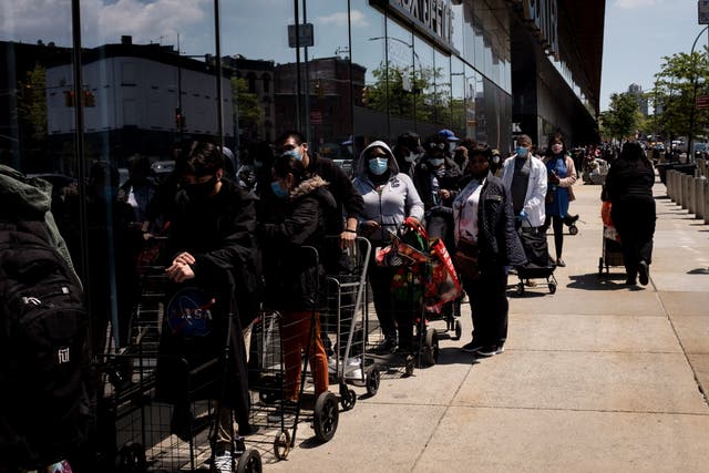 People facing financial stress waiting for food donations in Brooklyn