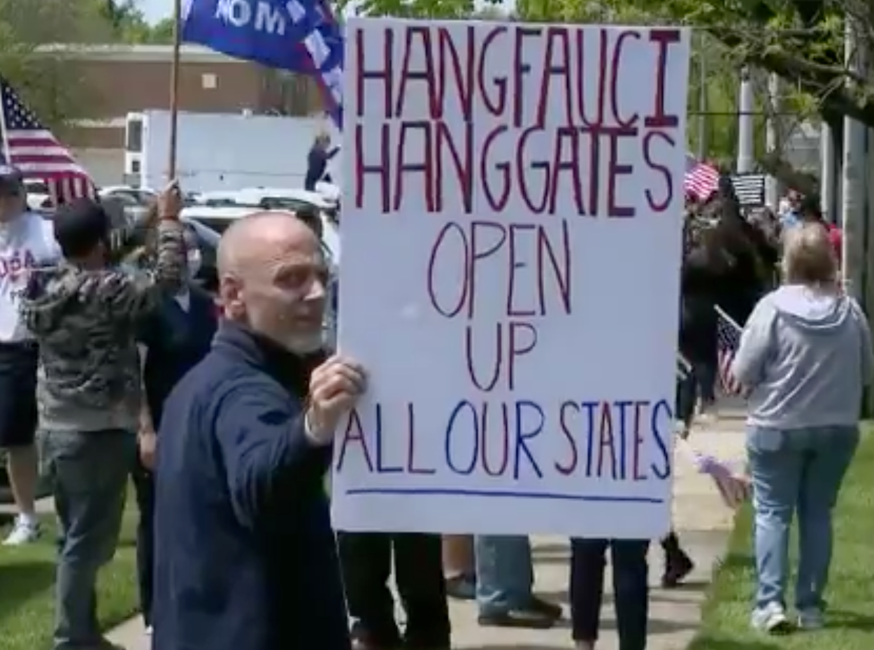 Protester holds disturbing sign at anti-lockdown rally