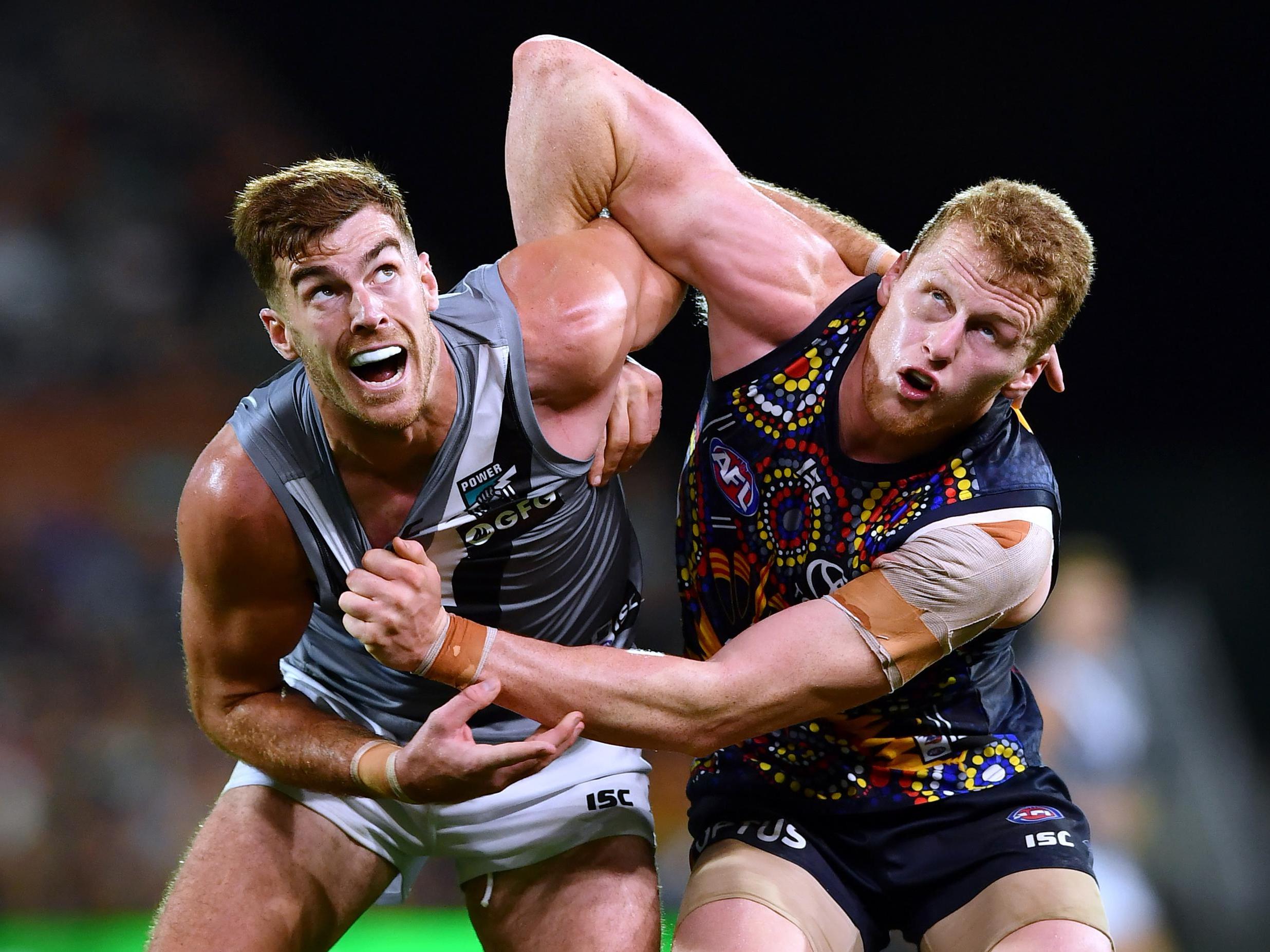 Scott Lycett of Port Adelaide rucks against Reilly O'Brien of the Adelaide Crows