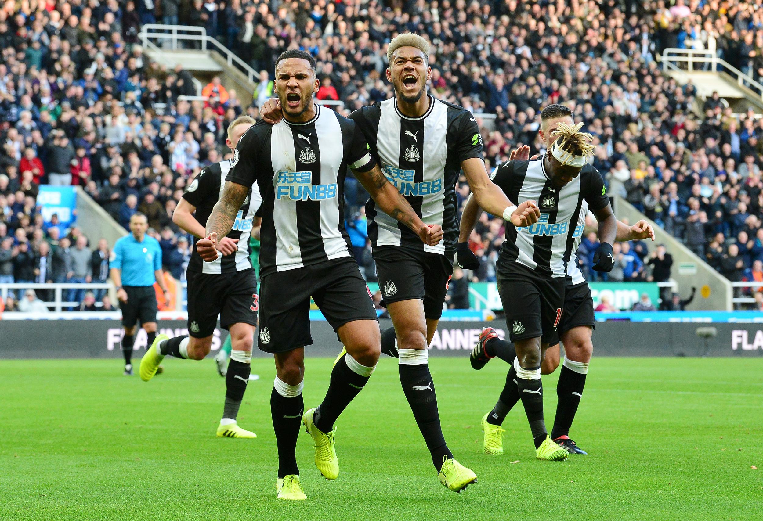 Jamaal Lascelles and Joelinton celebrate after scoring during the 2019 Premier League match between Newcastle United and Wolverhampton Wanderers
