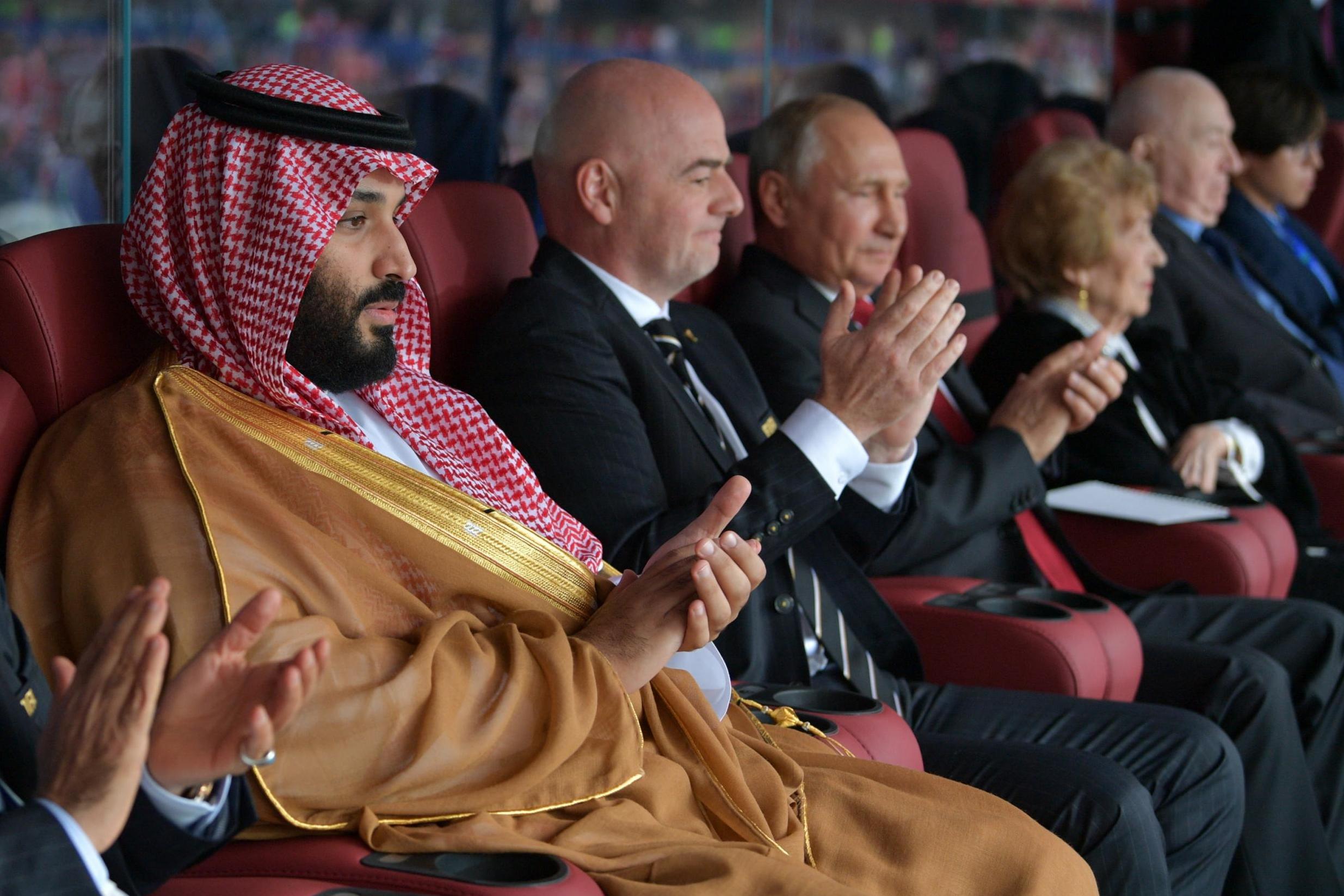 Mohammed bin Salman, Fifa president Gianni Infantino and Vladimir Putin watch the 2018 World Cup match between Russia and Saudi Arabia