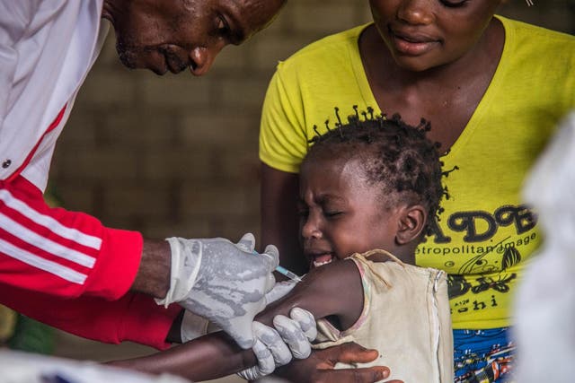 A toddler undergoes a measles vaccination at a centre in Temba, western DRC last March.