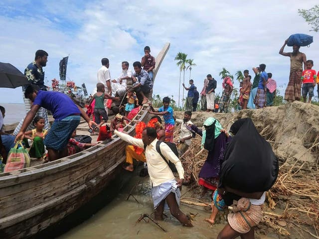 Residents are evacuated in Dhalchar village, on the island of Bhola, on Tuesday as Cyclone Amphan barrels towards Bangladesh