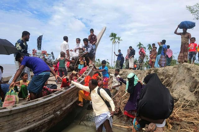 Residents are evacuated in Dhalchar village, on the island of Bhola, on Tuesday as Cyclone Amphan barrels towards Bangladesh
