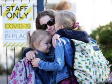 New Zealand parents drop off children at ‘kiss and go’ zones at school