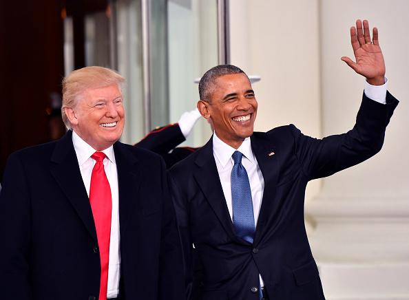 Smile like you mean it: the current and previous Oval Office incumbent certainly have their differences