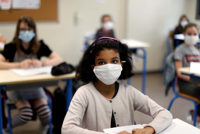 Students wear protective face masks at the College Sasserno school during its reopening in Nice, France, as a small number of French shoolchildren head back to their schools with new rules and social distancing during the outbreak of the coronavirus disease, 19 May 2020.