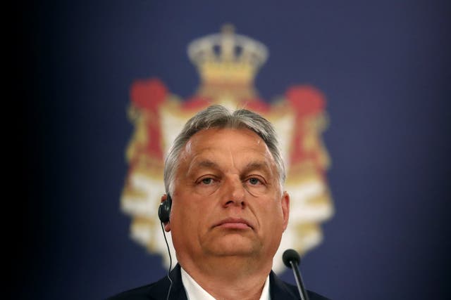 Hungarian Prime Minister Viktor Orban attends a news conference with Serbian President Aleksandar Vucic at the presidential building in Belgrade