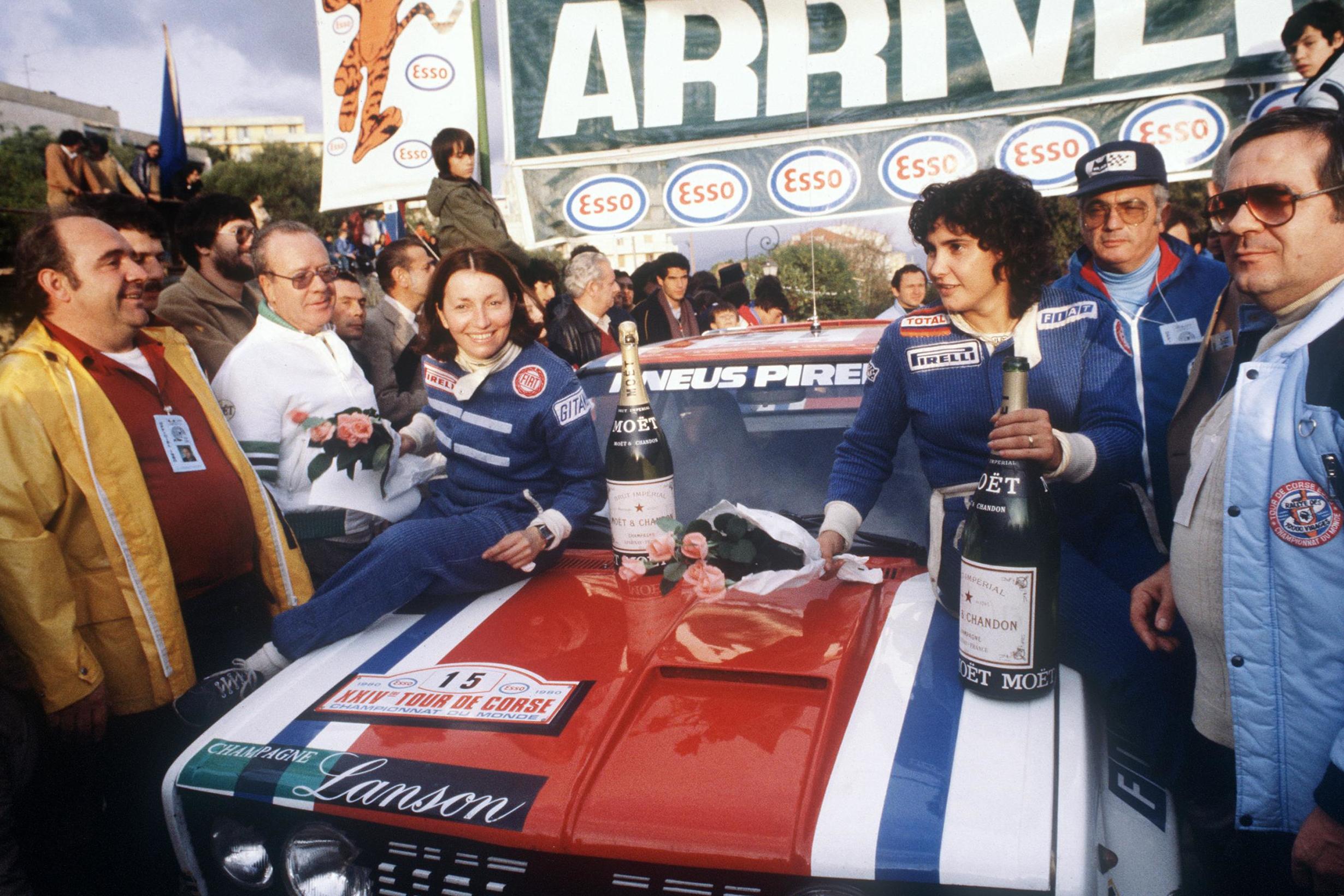 Celebrating with her team after finishing the Tour de Corse with a Fiat 131 Abarth in 1980