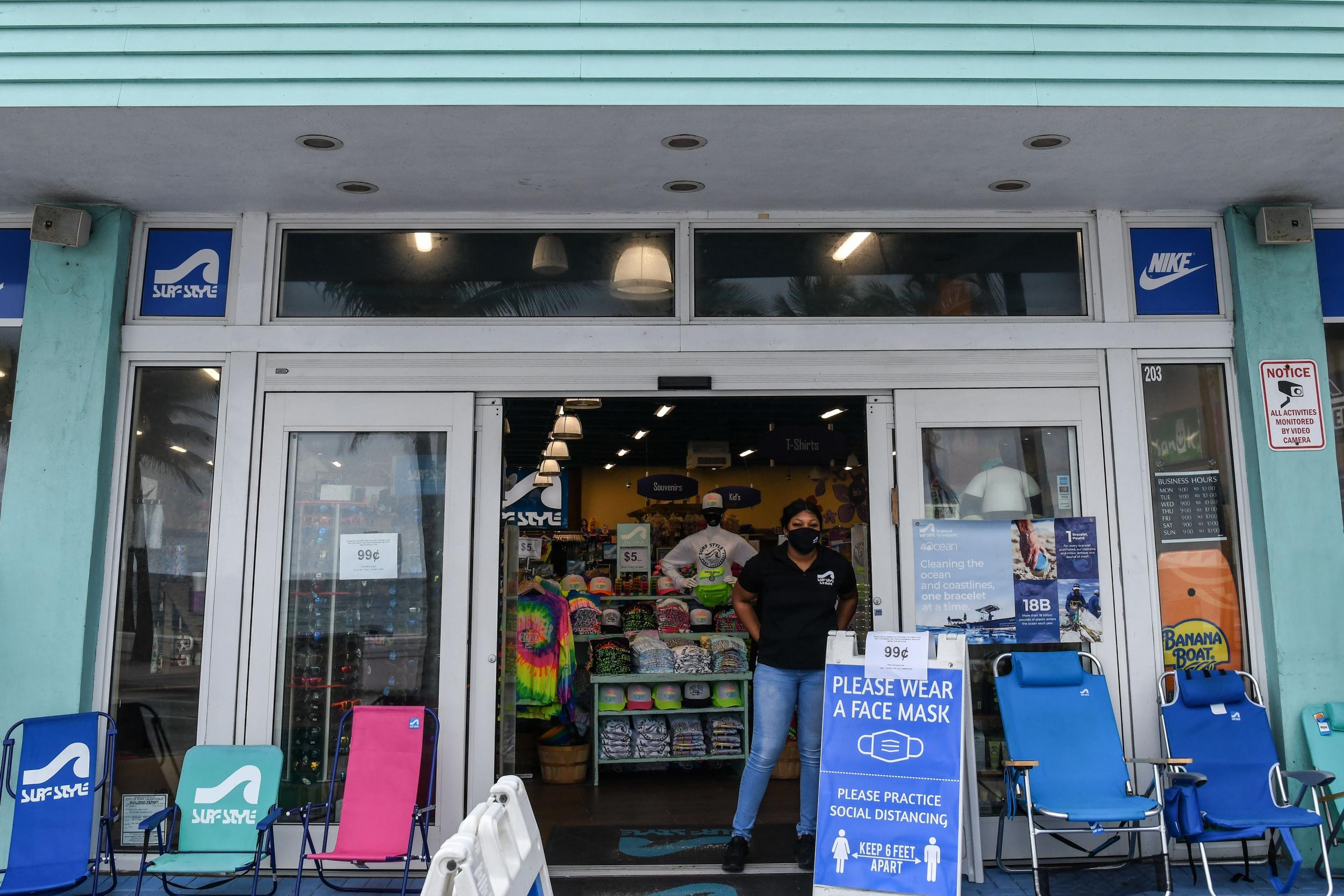 As states like Florida open their economies, one new poll shows most voters prefer Donald Trump to handle the economy over Joe Biden. AFP via Getty Images