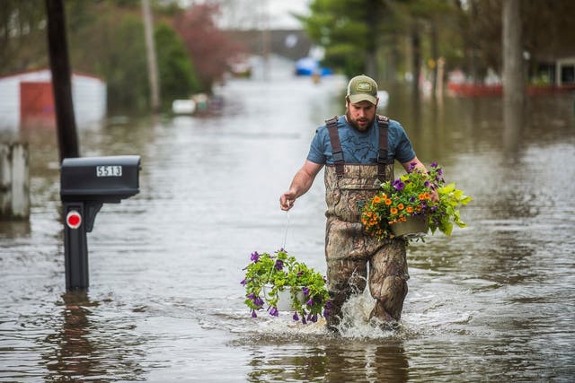 Flooding in Michigan's Midland County has sent residents scrambling to protect their homes