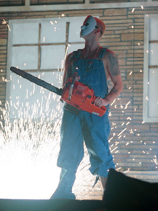 Eminem sports a Jason Voorhees mask and chainsaw in concert in October 2000
