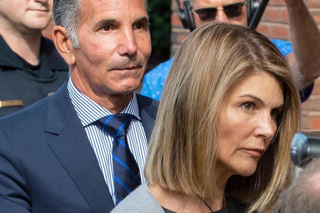 Lori Loughlin and Mossimo Giannulli exit the Boston federal courthouse on 27 August 2019.