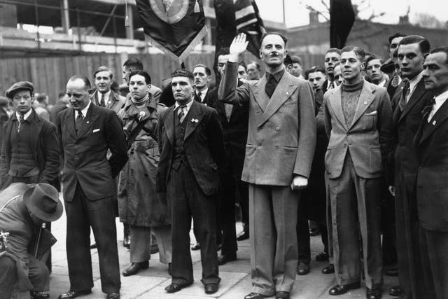 British Union of Fascists leader Oswald Mosley salutes supporters during a march in Bermondsey, London