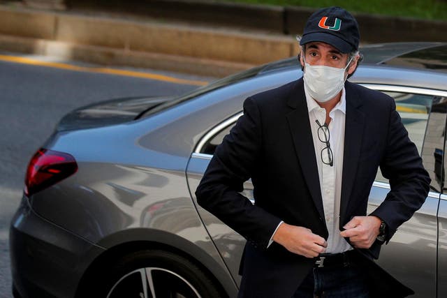 Michael Cohen arriving back at his home after being released early from prison