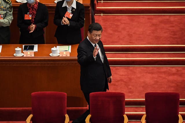 President Xi Jinping arrives for the opening session of the National People’s Congress in Beijing yesterday