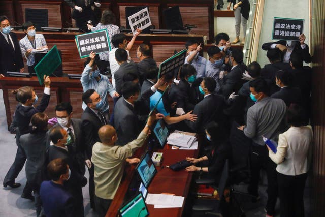 Pan-democratic legislators scuffle with security as they protest China's new security laws