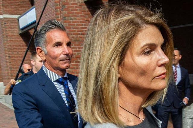 Lori Loughlin and Mossimo Giannulli exit the Boston federal courthouse on 27 August 2019.