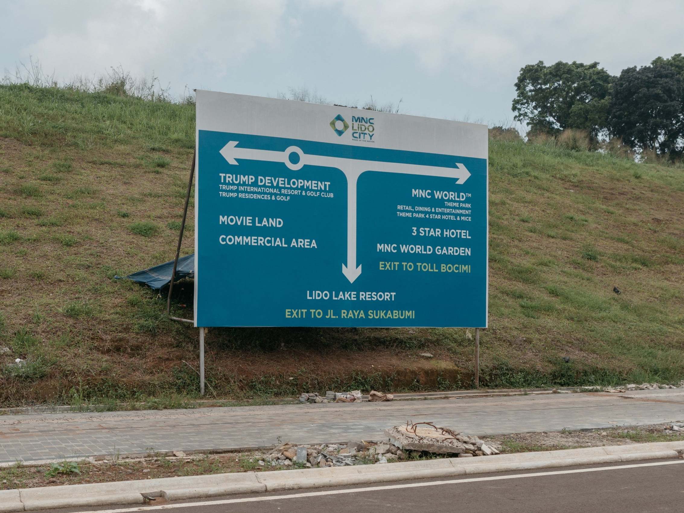 A roadside signpost with details of the MNC Lido City development (The Washington Post)