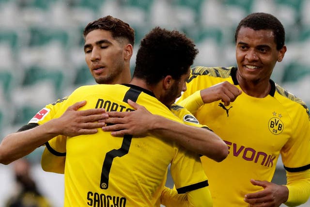 Borussia Dortmund's Achraf Hakim celebrates with Jadon Sancho
