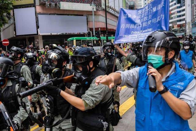 Riot police during a protest against a planned national security law in the Causeway Bay district of Hong Kong