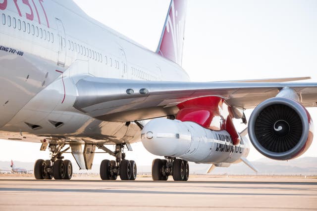 Air lift: the LauncherOne rocket is attached to the left wing of a Boeing 747