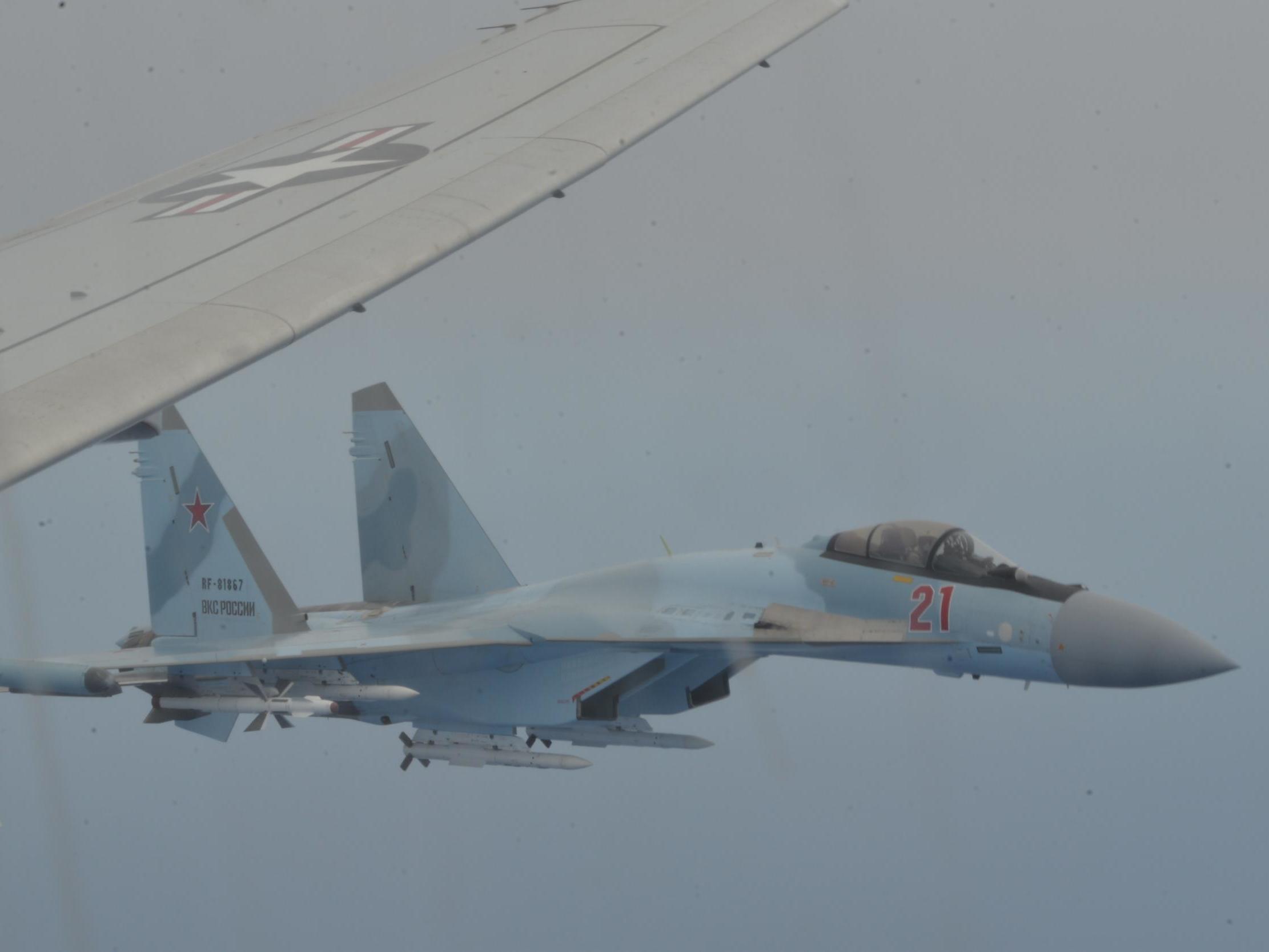 Two Russian fighter jets &apos;irresponsibly&apos; intercept US aircraft, Navy says