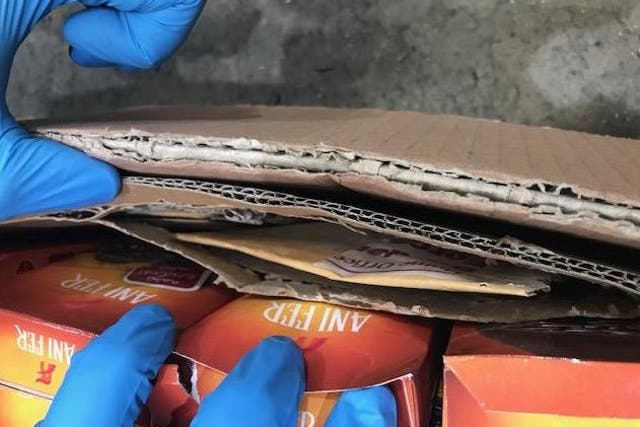 An envelope of heroin concealed in a cardboard box containing a shipment of fruit and nuts at Heathrow Airport