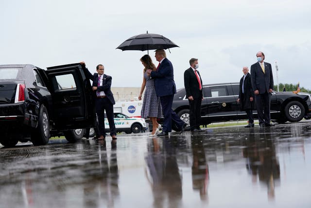 Donald Trump and Melania Trump arrive at the Nasa Shuttle Landing Facility in Florida