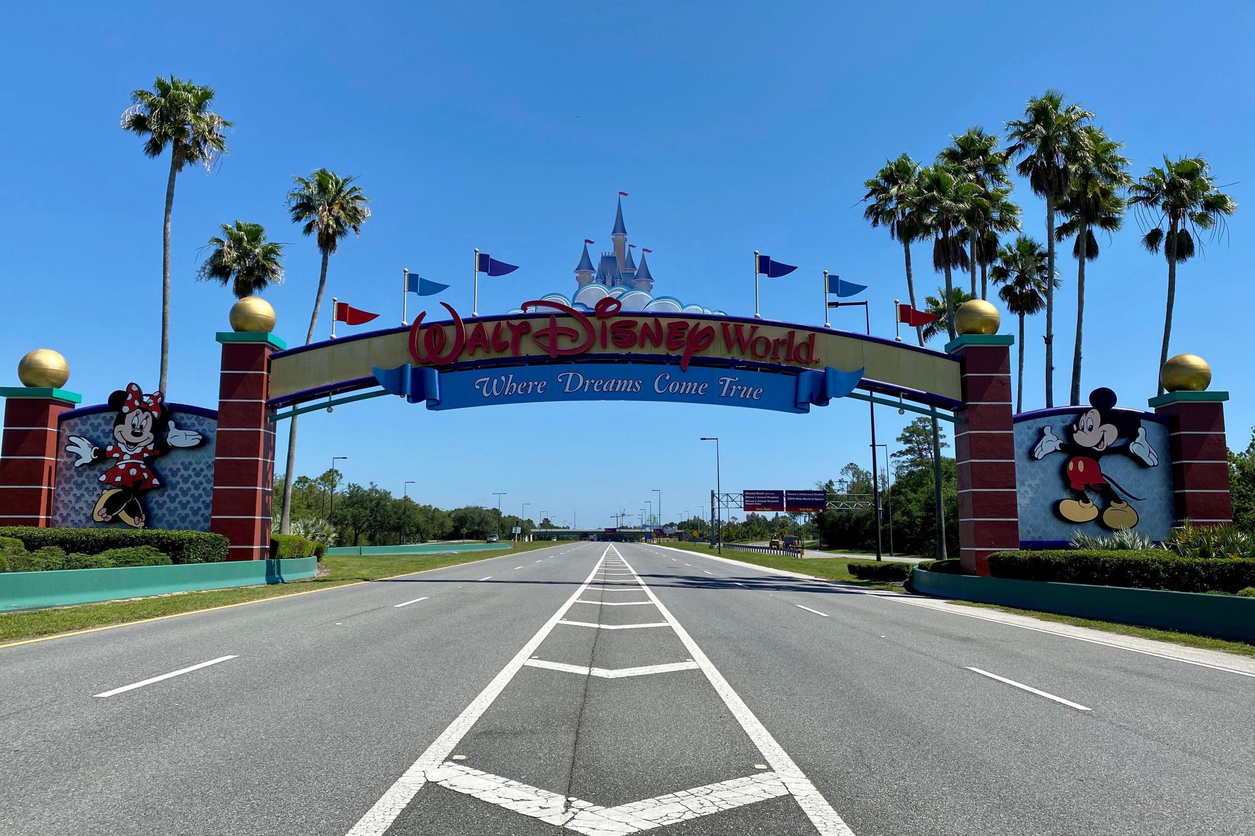 An empty road leads into a deserted Disney resort after it was closed due to the Covid-19 pandemic in Kissimmee, Florida.