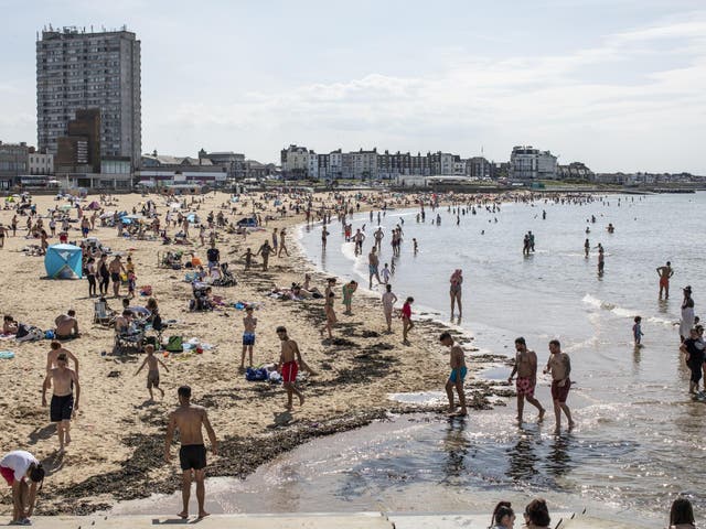 Members of the public relax on the beach on May 26, 2020 in Margate, England.