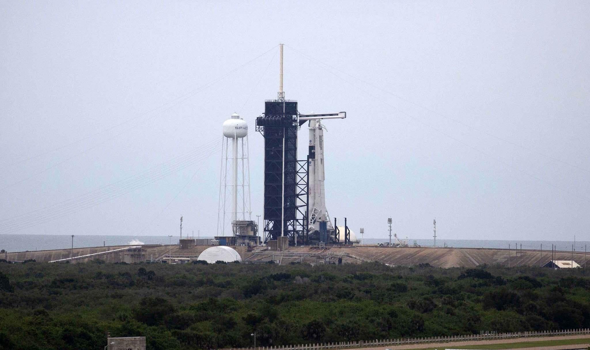 The SpaceX Falcon 9 rocket with the manned Crew Dragon spacecraft sits on launch pad 39A at the Kennedy Space Center on May 27, 2020 in Cape Canaveral, Florida
