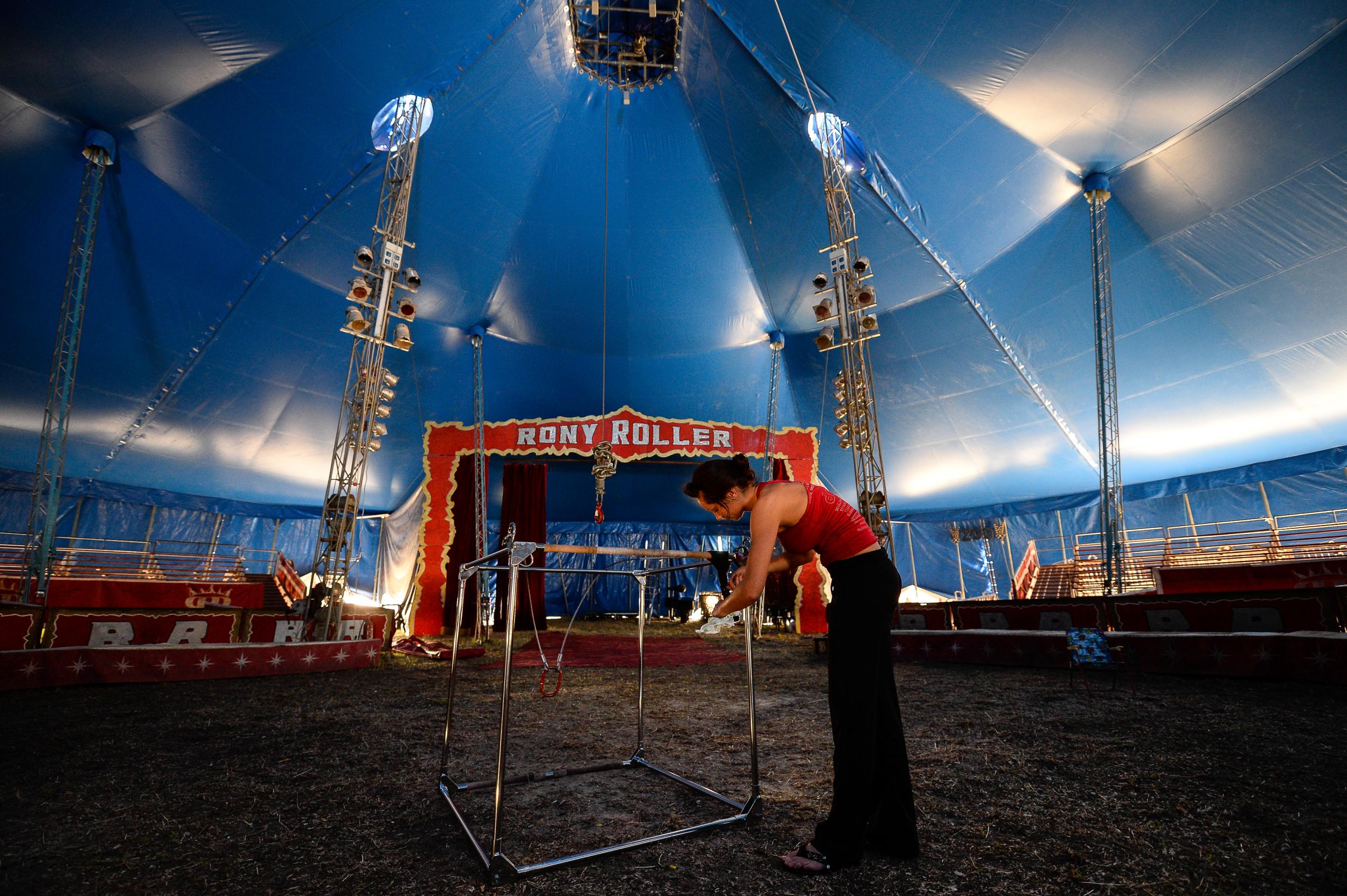 Marina Delicosti, an acrobat in Rony Roller’s Circus, prepares his equipment