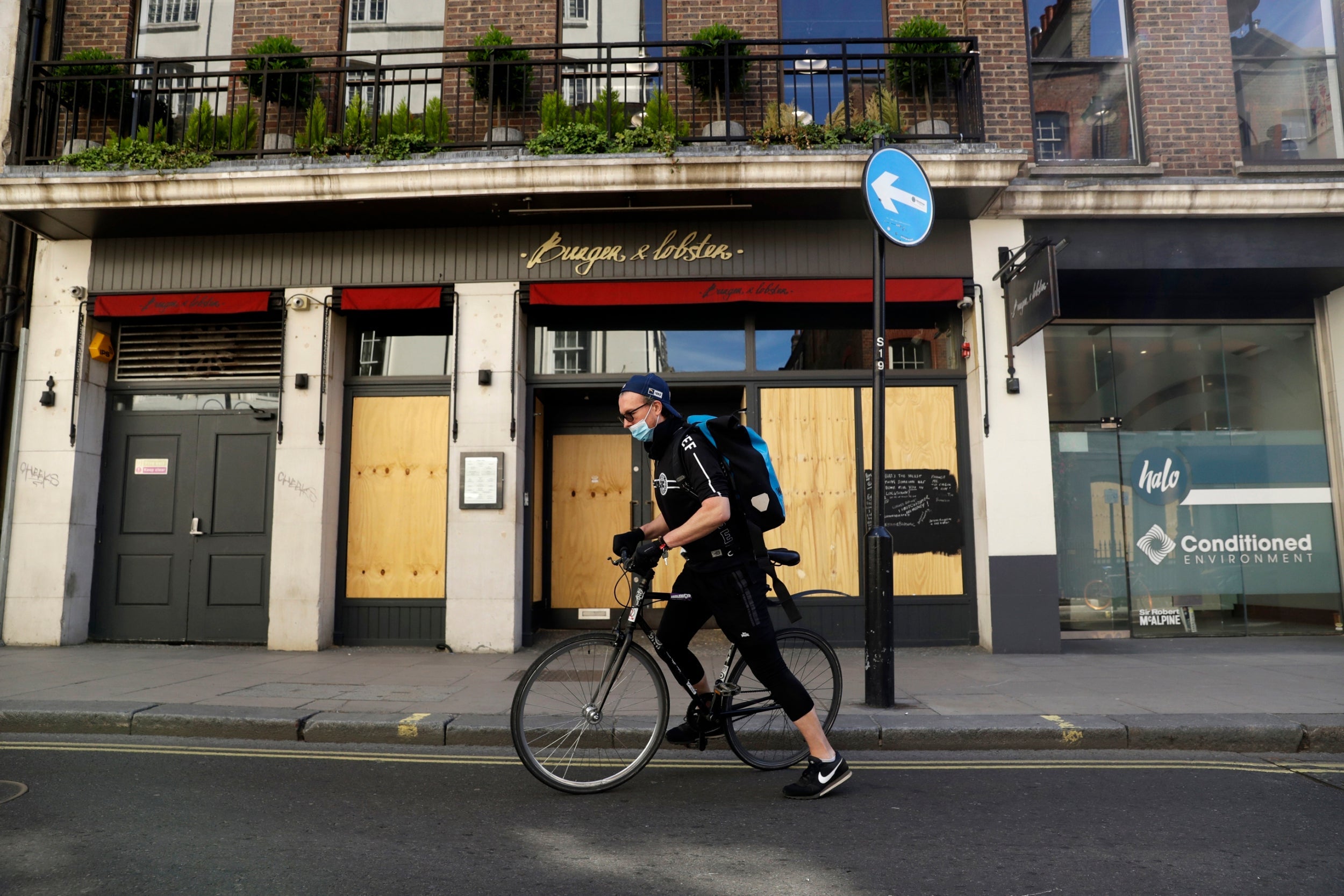 A courier for The Doctors Laboratory after picking up a coronavirus test sample in London