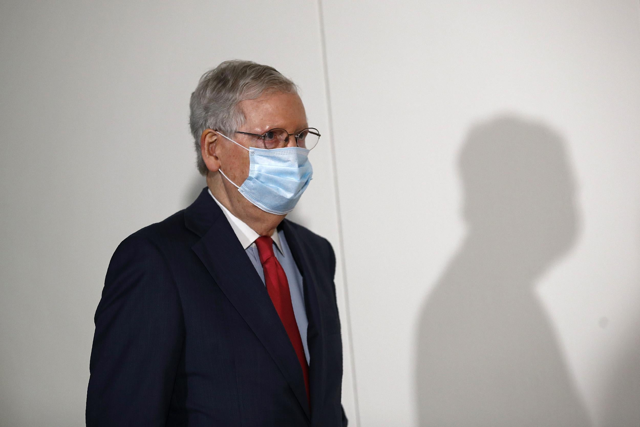 Senate Majority Leader Mitch McConnell wears a face mask used to protect against the spread of the new coronavirus as he attends a press conference after meeting with Senate Republicans on 19 May, 2020