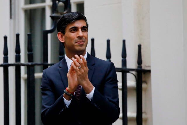 <p>Rishi Sunak participates in a national "clap for carers" to show thanks for the work of NHS workers during the pandemic last year </p>