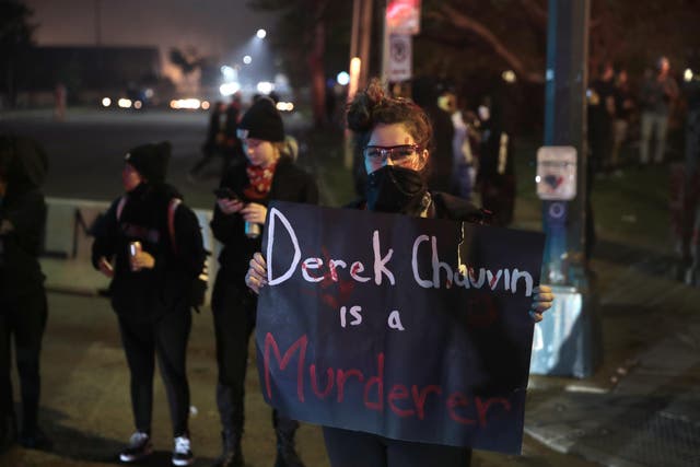 Protesters gathered yesterday near the third precinct police building