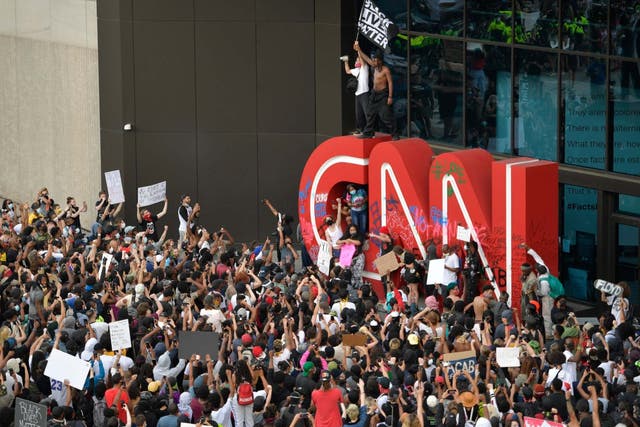 Demonstrators gather outside the CNN building in Atlanta during protests in response to the death of George Floyd