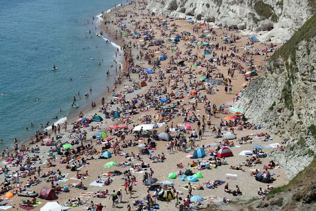 <p> The beach at Durdle Door was crowded  over the summer</p>