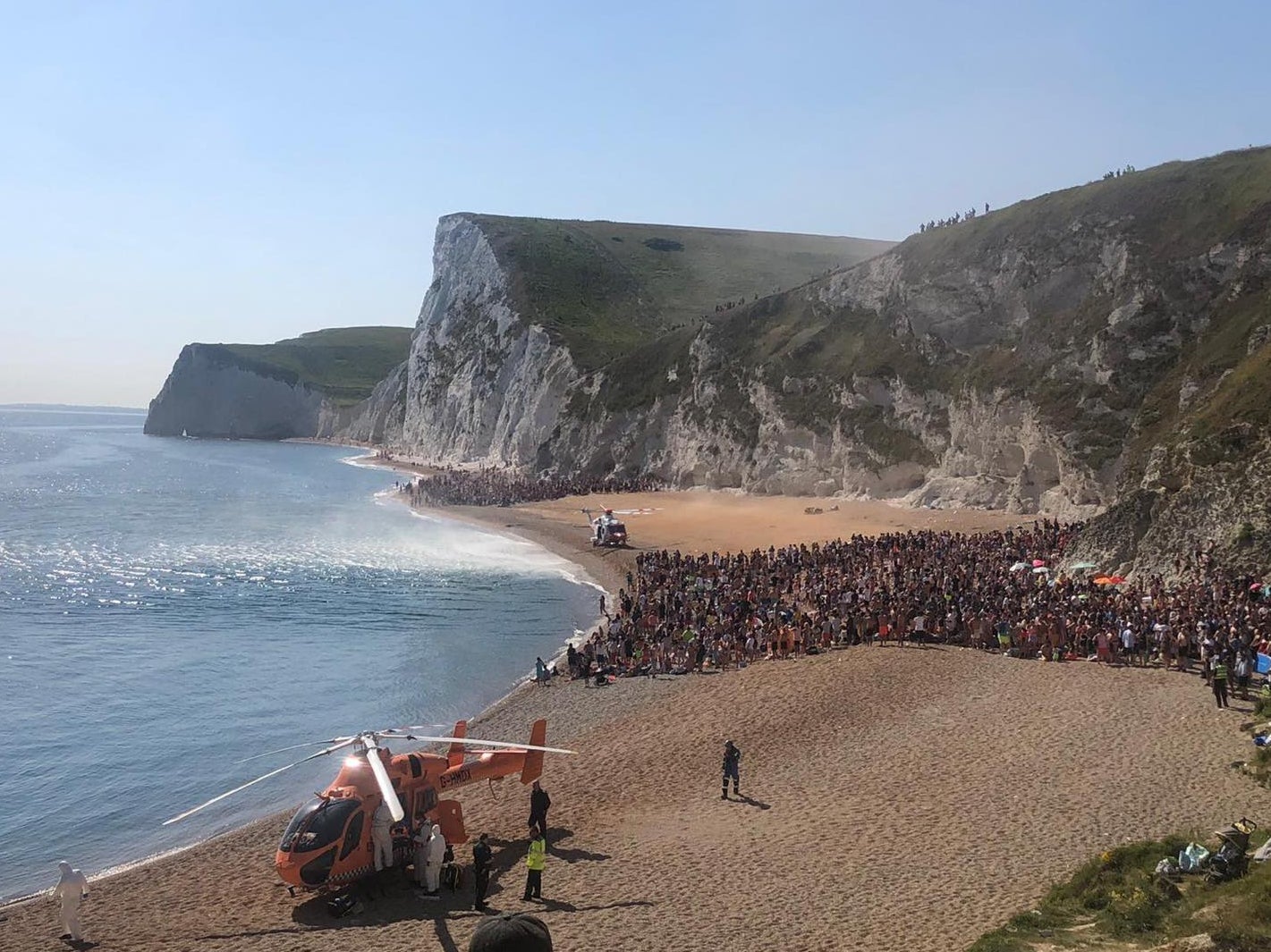 Durdle Door: Four injured in 200ft cliff jump, prompting police to close packed beach