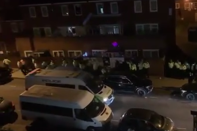 Police attempt to break up the illegal party in east London